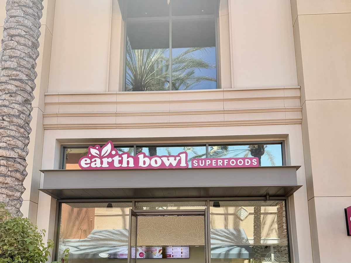 Earth Bowl Superfoods storefront at Irvine Spectrum with customers at the counter